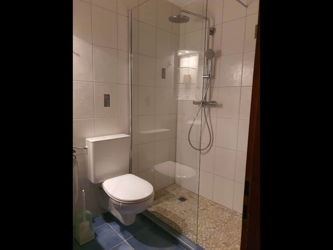 The bathroom is equipped with a walk-in shower.